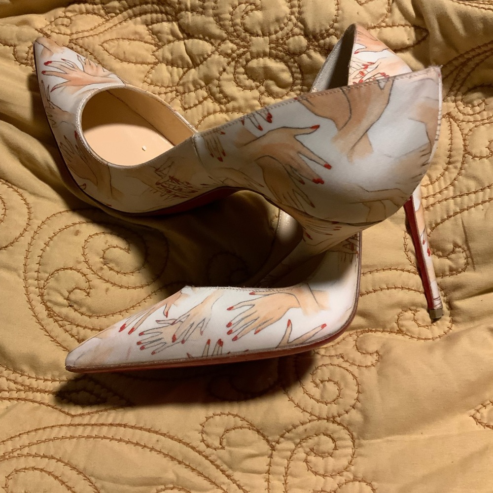 Christian Louboutin high heel shoes, size  39.5. No tears or rips.